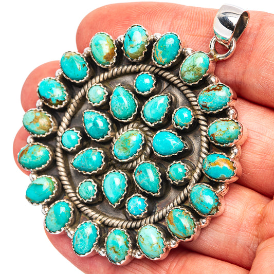 Turquoise stone pendant with round silver bezel settings, clustered rosette design