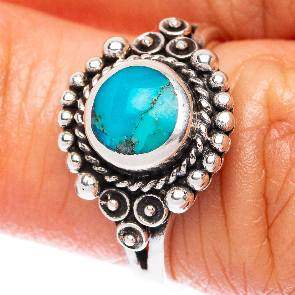 Sterling silver turquoise ring with oval stone and raised beadwork bezel