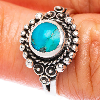 Sterling silver turquoise ring with oval stone and raised beadwork bezel