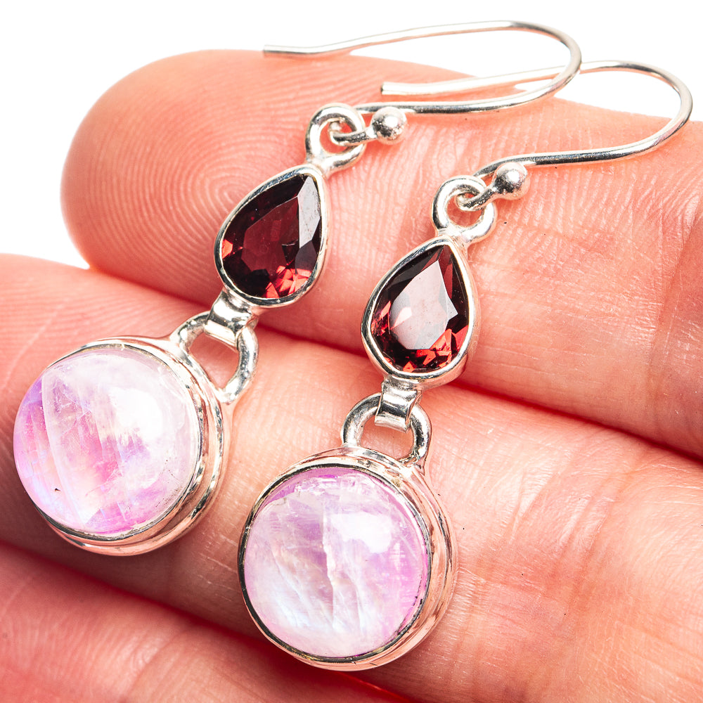 925 sterling silver drop earrings with pink moonstone discs and red garnet teardrops on hooks.