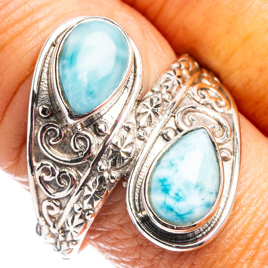 Sterling silver larimar ring with two oval blue stones and ornate filigree sides.