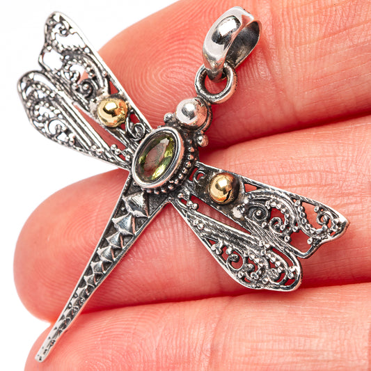 Dragonfly pendant in .925 sterling silver with green center stone and small gold accents