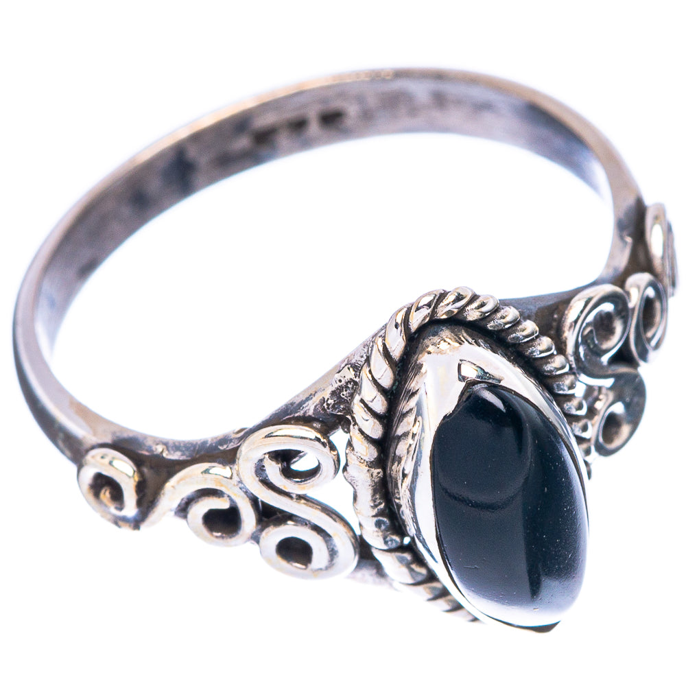 Sterling silver onyx ring with dark oval stone and scrollwork side settings