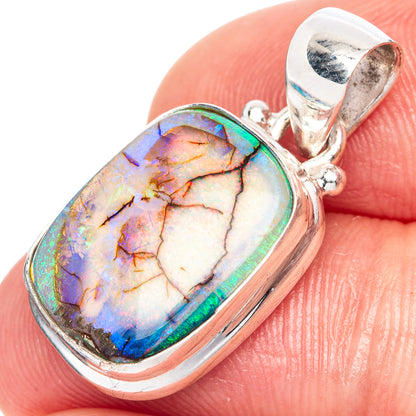 Sterling silver opal pendant with colorful iridescent oval stone in bezel