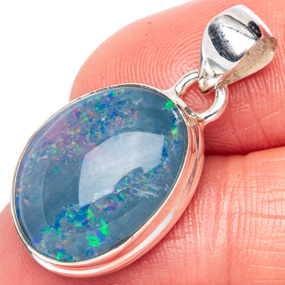 Sterling silver oval opal pendant with bezel and jump ring bail