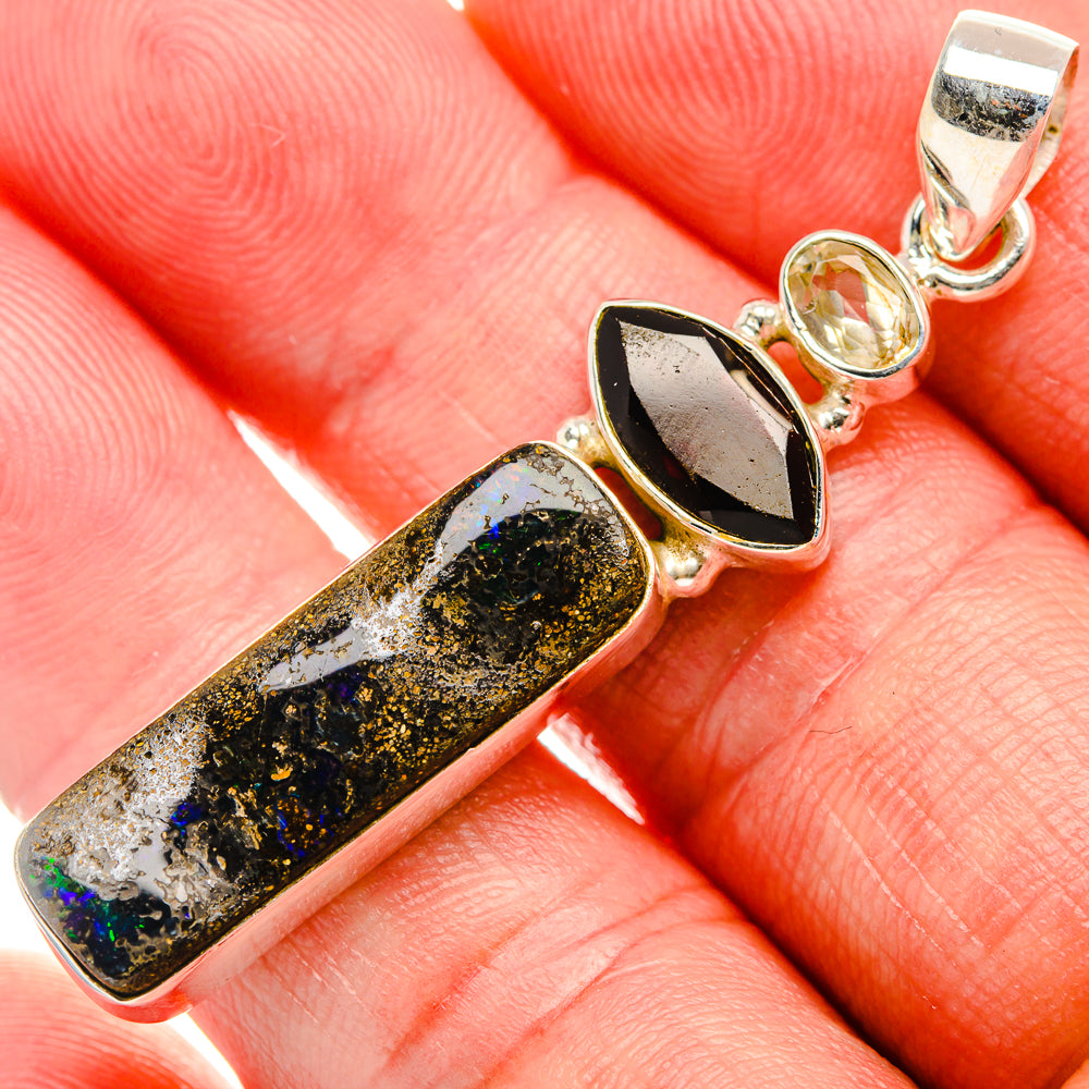 925 sterling silver pendant with elongated black-and-gold stone and marquise yellow/black