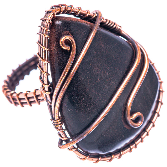 Oxidized copper ring with two dark jet-like stones and swirl wirework