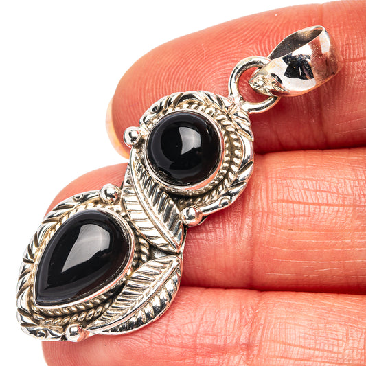 Sterling silver onyx pendant with two oval black stones and twisted edge setting