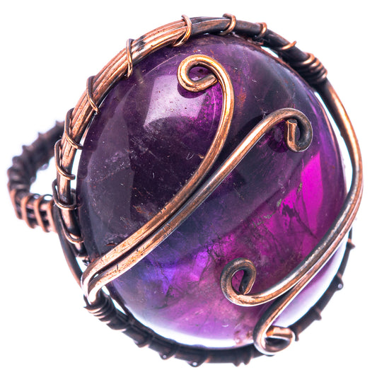 Size 7.5 amethyst ring with purple cabochon and oxidized copper wire wrap, scroll accents
