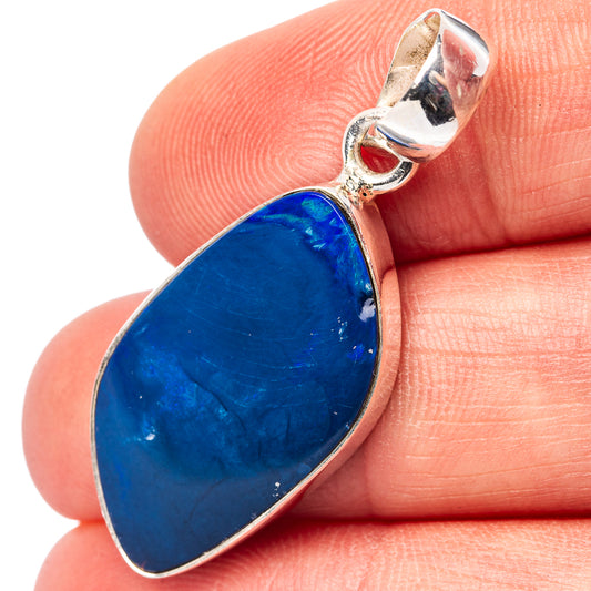 Sterling silver opal pendant close-up with oval blue stone and loop bail