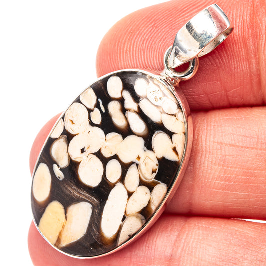Oval sterling silver pendant with peanut wood jasper stone and bezel setting