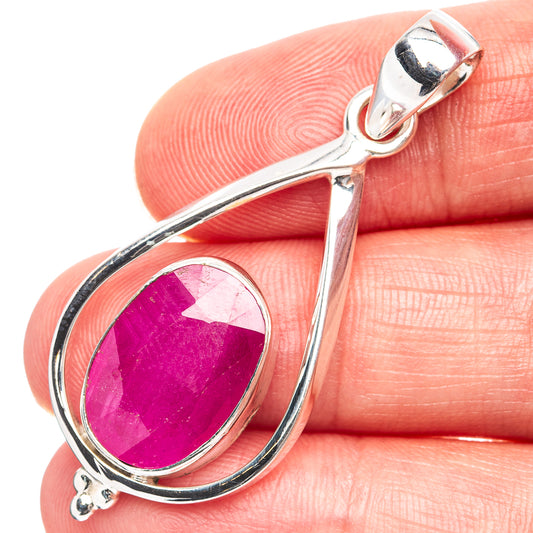 Sterling silver teardrop pendant with oval magenta gemstone centerpiece