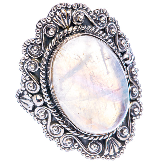 Sterling silver oval moonstone ring with textured filigree edge and bright iridescence