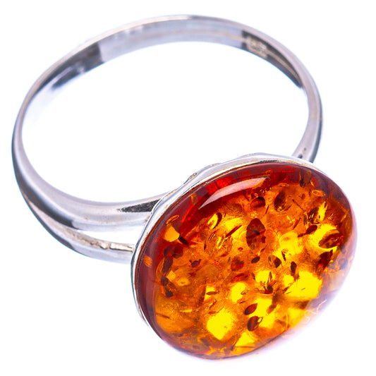 Silver ring with round amber cabochon, side view showing bezel and band