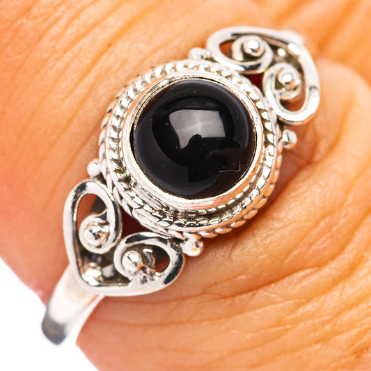 Sterling silver ring with black onyx oval cabochon and ornate filigree band