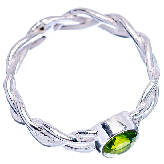 Sterling silver peridot ring featuring green gemstone and twisted open band