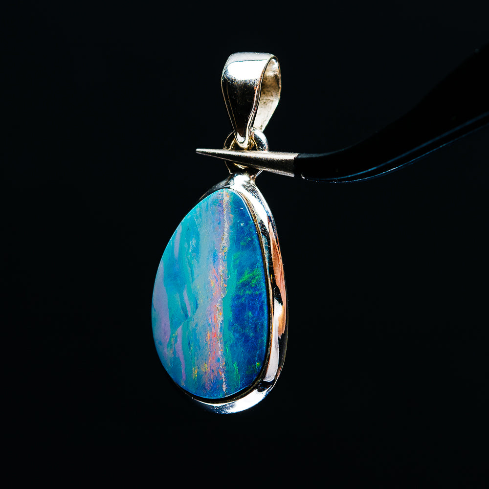 Sterling silver teardrop fire opal pendant with blue-green rainbow sheen