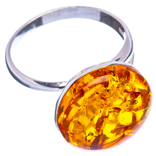 Amber cabochon ring with openwork .925 sterling silver band, adjustable size 7