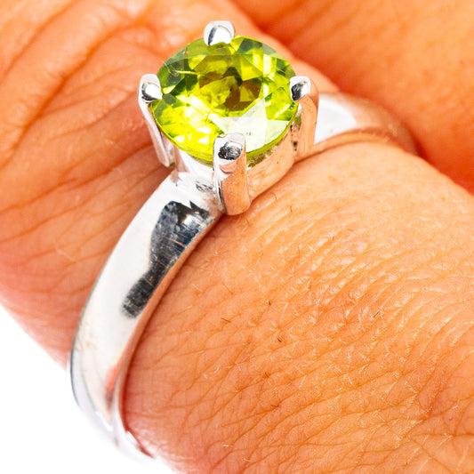Faceted peridot gemstone ring with round green stone in .925 sterling silver setting