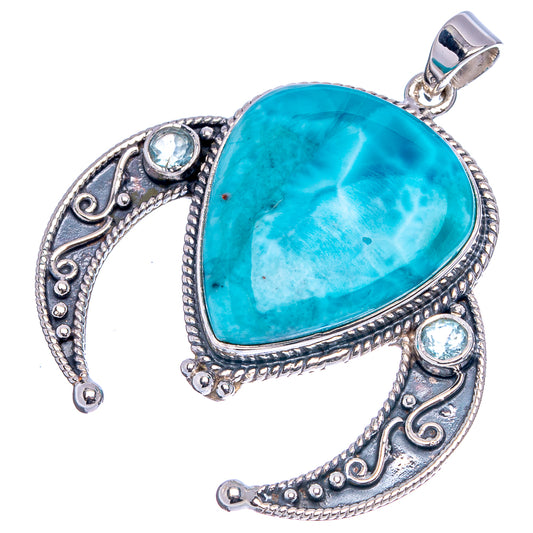 Sterling silver pendant featuring a turquoise Larimar-style teardrop stone with blue topaz highlights
