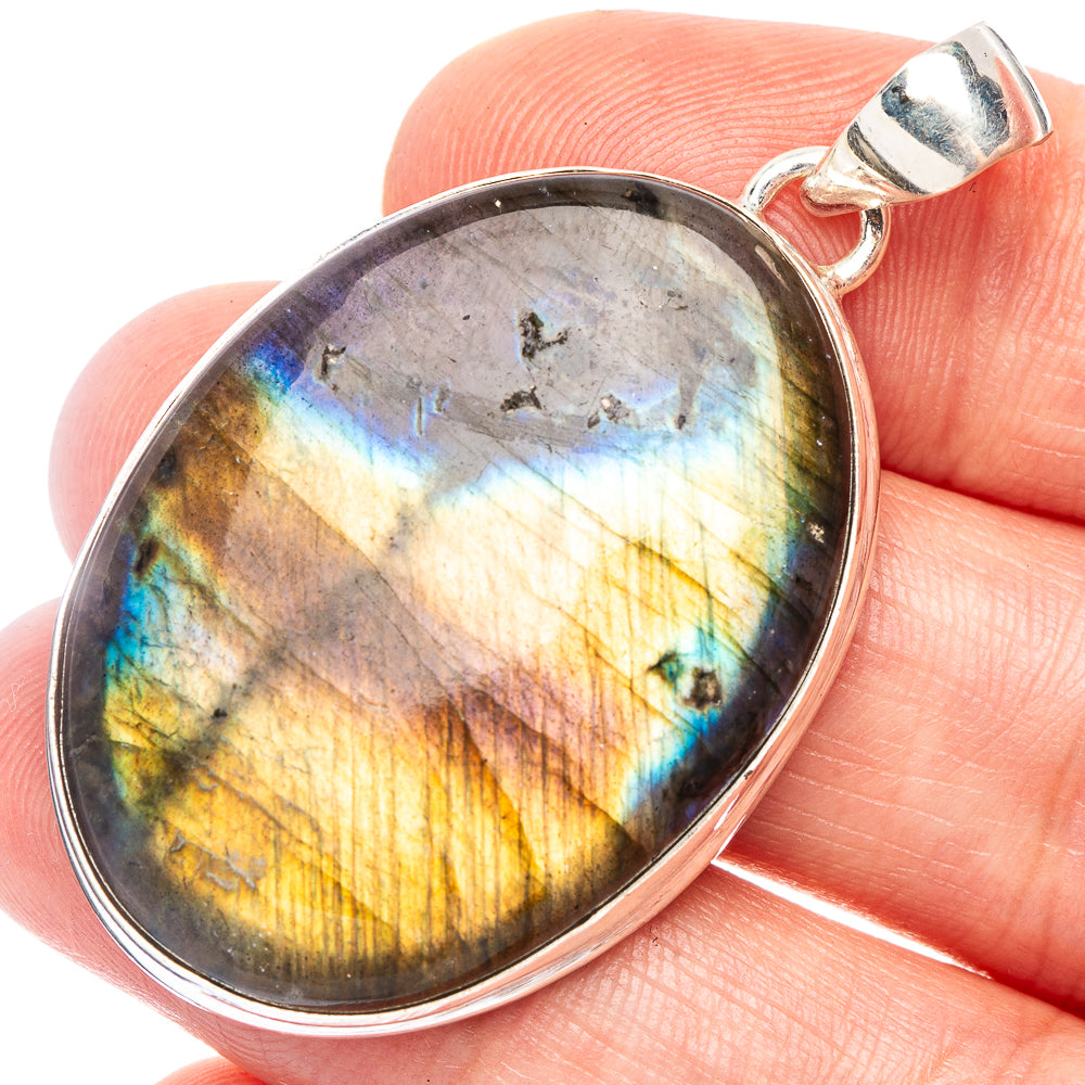 Labradorite pendant in oval sterling silver bezel with iridescent blue-gold flash