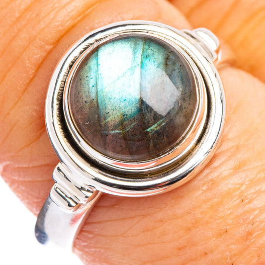 Labradorite sterling silver ring with oval iridescent blue-green stone, close-up
