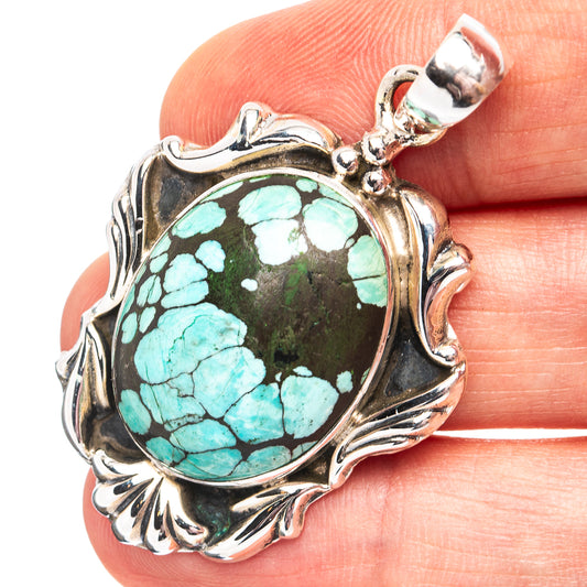 Ornate .925 sterling silver turquoise cabochon pendant with round center stone