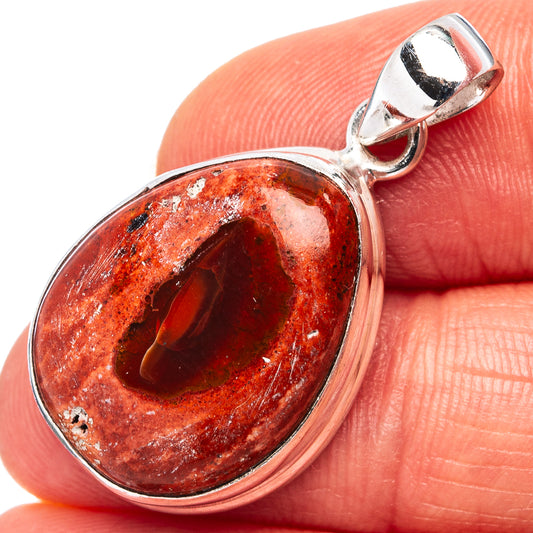 Sterling silver oval fire opal pendant with red-orange gemstone and polished bale