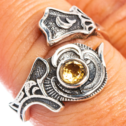 Dainty sterling silver ring with round citrine-yellow gemstone and ornate scrolling band