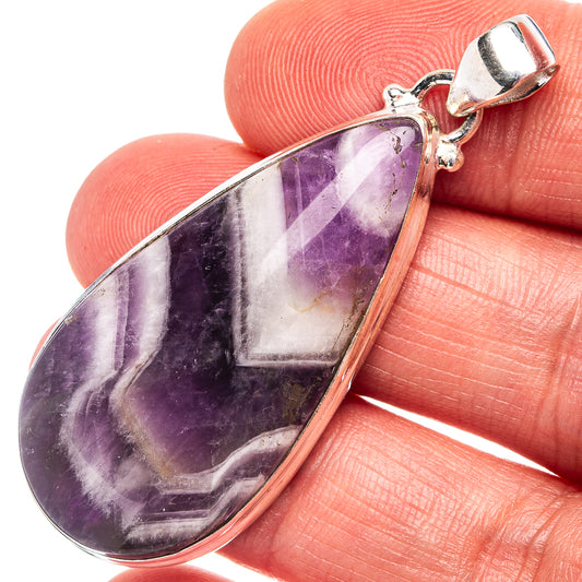 Amethyst teardrop pendant in .925 sterling silver bezel with loop bail