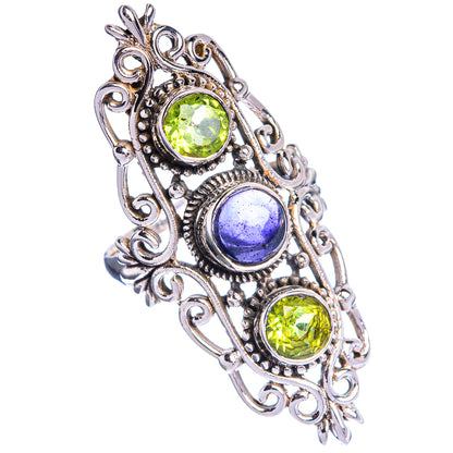 Sterling silver filigree ring with green and blue gemstones, leaf scrollwork setting