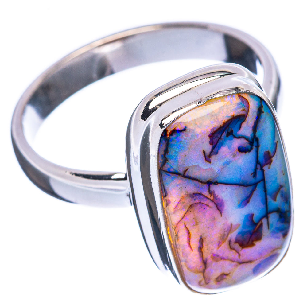 Sterling silver opal ring with oval iridescent blue-purple stone in curved bezel