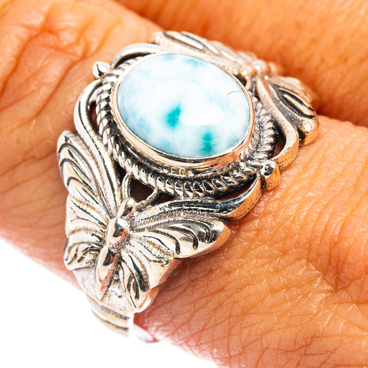 Sterling silver butterfly ring with oval light-blue stone and engraved leaf shank