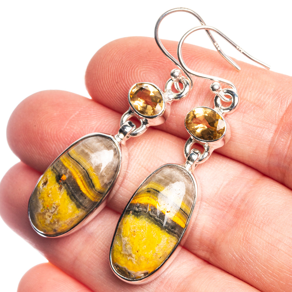Sterling silver-tone dangle earrings with oval bumble bee jasper and round yellow stones