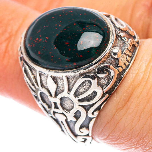 Oval dark green bloodstone-style ring with ornate sterling silver scrollwork