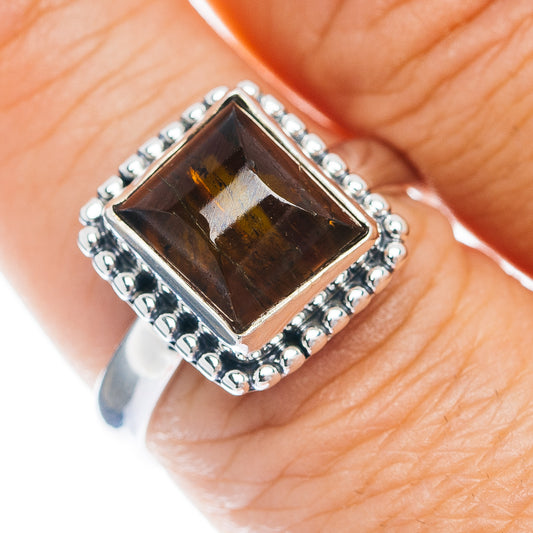 Sterling silver ring with square amber tourmaline and beaded edge, close-up top view