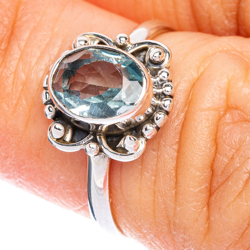 Blue topaz dainty oval ring in 925 sterling silver with ornate silver prongs