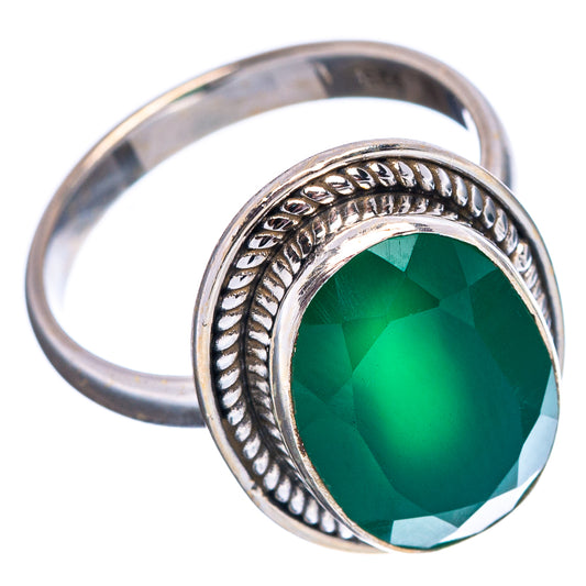 Sterling silver ring with green faceted oval gemstone and braided detail border