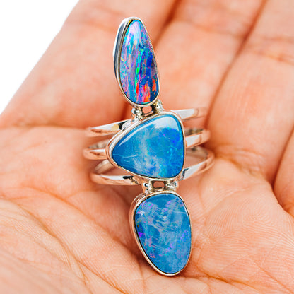 Three-stone fire opal ring in sterling silver, blue teardrop cabochons on band