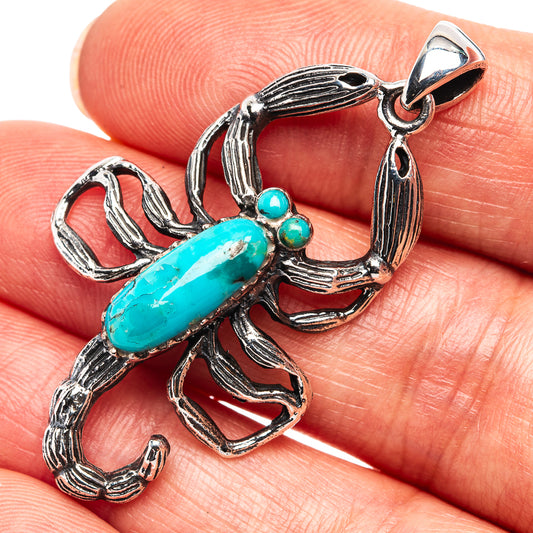 Turquoise scorpion pendant in .925 sterling silver with one large oval and small bead accents