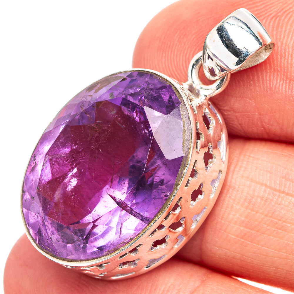 Amethyst pendant with oval faceted purple gemstone and .925 sterling silver setting