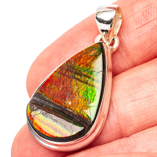 Teardrop ammolite pendant with rainbow iridescent stone in .925 sterling silver bezel.