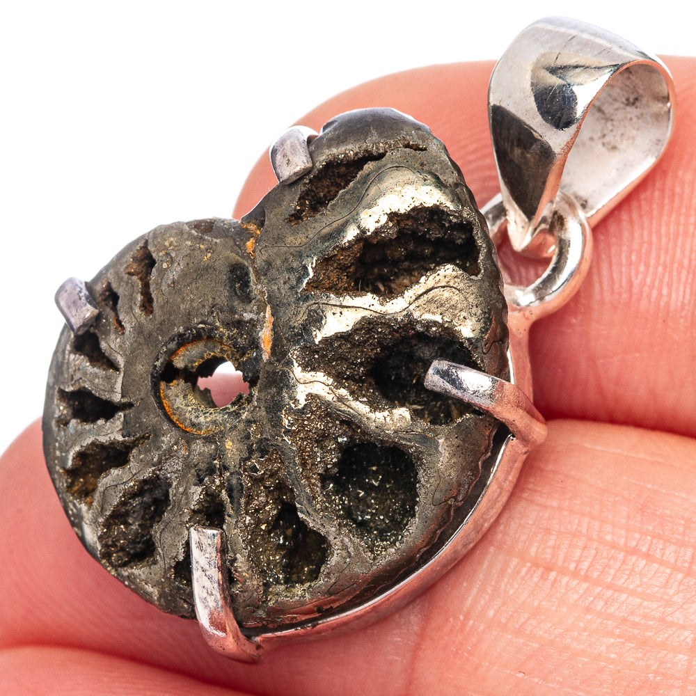 Pyritized ammonite pendant with silver bail, dark fossil texture and gold highlights