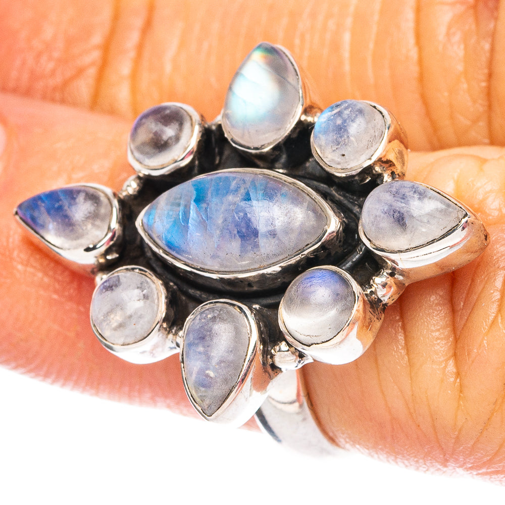 Oval moonstone sterling silver ring with bezel-set blue iridescent stones