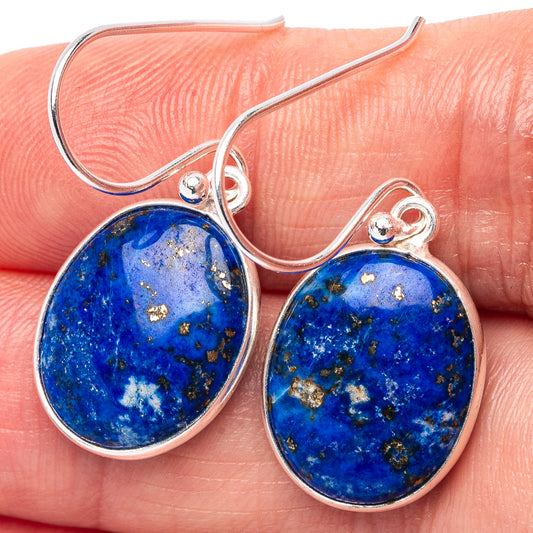 Sterling silver drop earrings with blue lapis oval stones and gold flecks on hooks