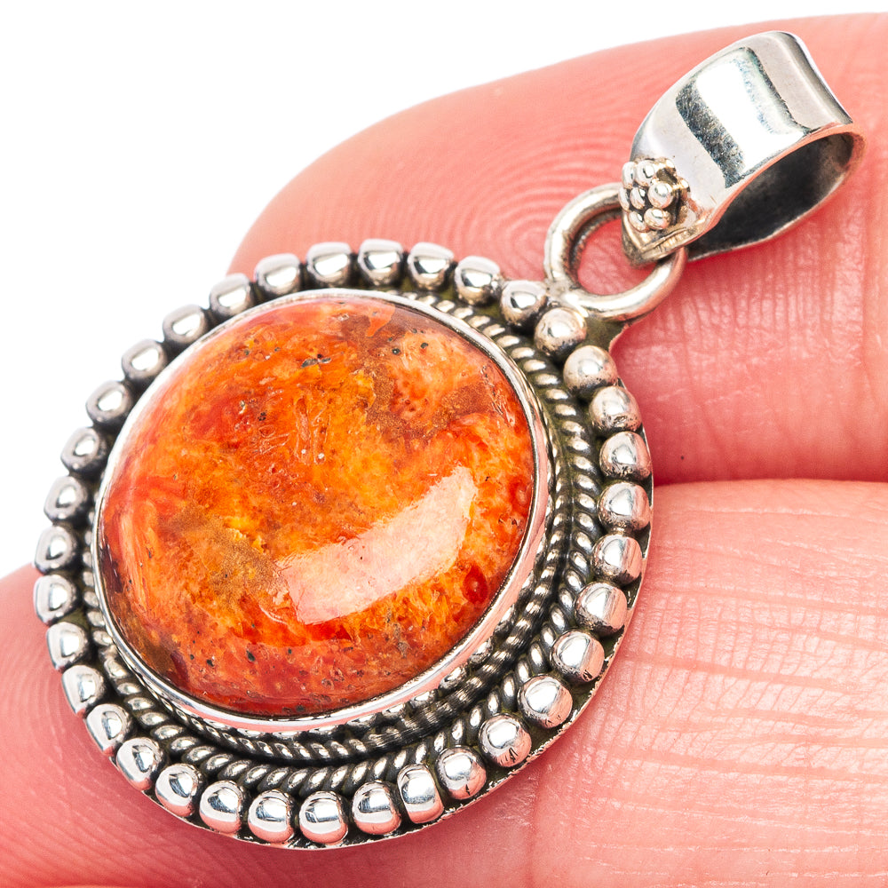 Orange sponge coral cabochon pendant detail in 925 sterling silver with textured border