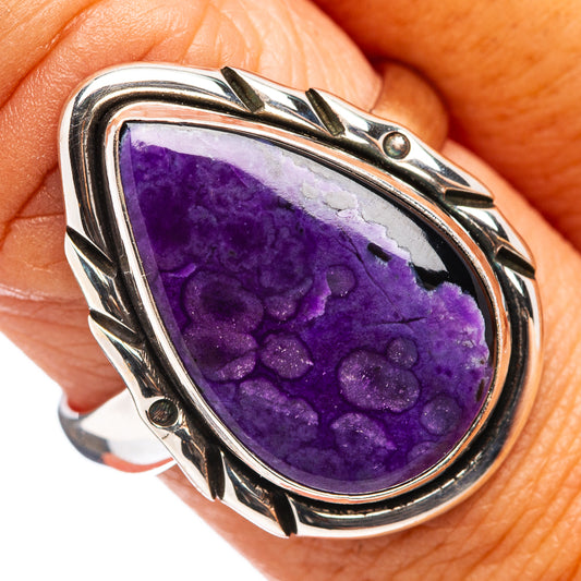Sterling silver sugilite gemstone ring with purple teardrop stone in ornate bezel