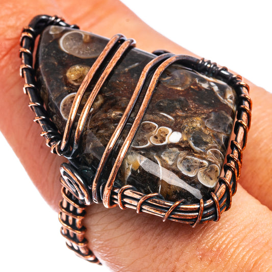 Oxidized copper wire wrap ring with dark turritella agate stone, oval cut