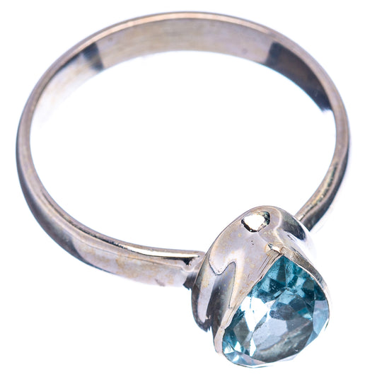 Sterling silver ring with faceted blue topaz oval stone, open side view