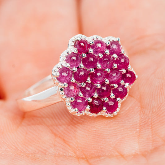 Cluster ruby gemstone ring in .925 sterling silver, pink-red stones with scalloped halo.